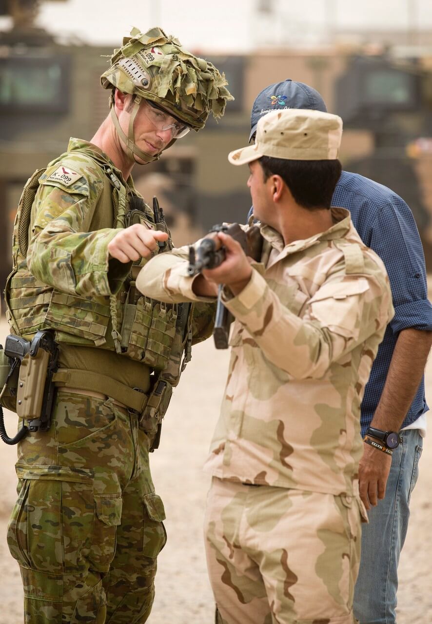 CAPT Josh Watson from 1 Fd Sqn instructs basic marksmanship principles to an Iraqi Army soldier on Range 4 at Taji Military Complex.